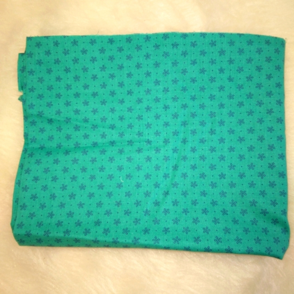 FABRIC Small navy simple flowers regularly spaced on teal background JoA…